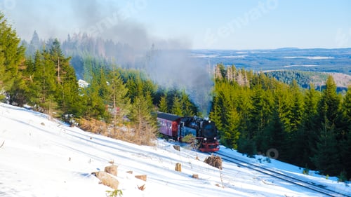Preview: Steam train during winter in the snow in the Harz Germany Brocken Bahn