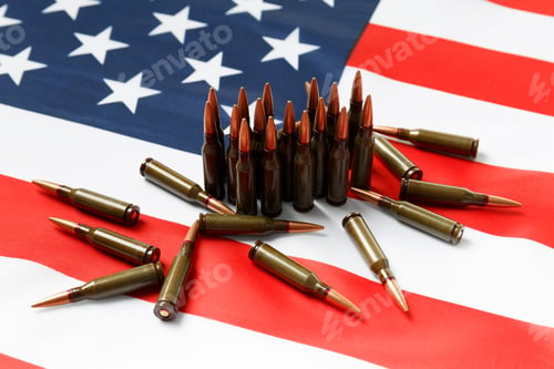 Preview: Bullets for firearms, combat army cartridges on the American flag.