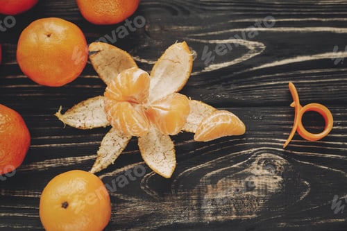 Preview: Tangerines with green fir branches with cones and anise on rustic wooden background