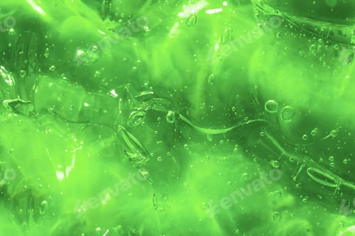 Visualização: Textura de gel verde transparente. Textura do soro de óleo com bolhas. Produto de beleza hidratante