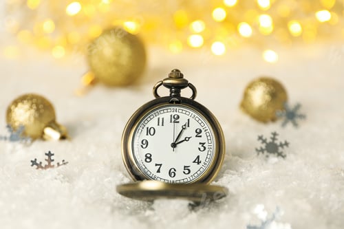 Preview: Pocket watch with snow on a light background.