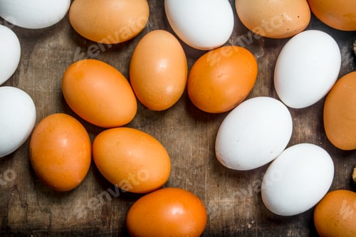 Preview: Eggs on wooden background.