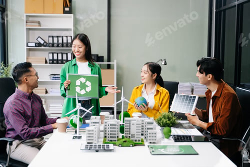 Preview: Group of diverse multiethnic businesspeople standing neare table looking at model of building from