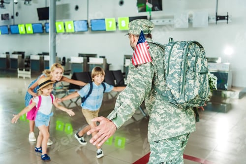 Preview: happy family meeting father in military uniform at airport