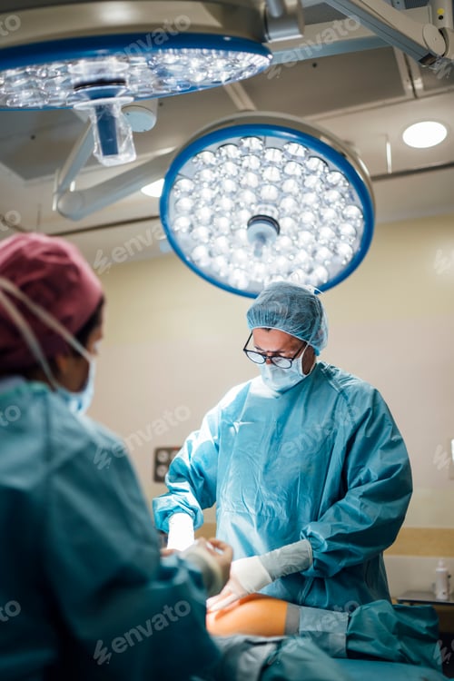 Preview: Surgeons Performing Operation in Brightly Lit Operating Room