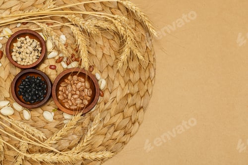 Preview: Flat lay of healthy grain concept, Various bean in wooden bowl pistachios wheat on brown background