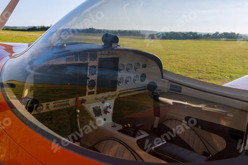 Preview: Cockpit View of a Small Plane on Field