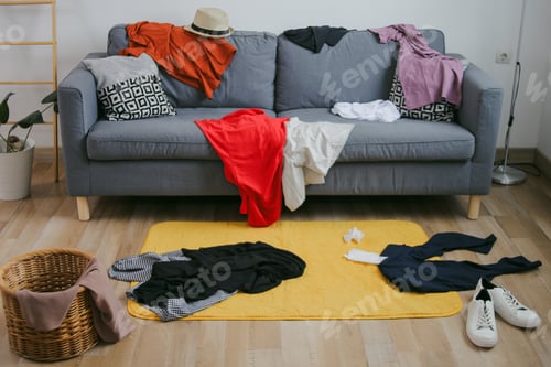 Preview: Messy Clothes On Sofa, Carpet And Floor