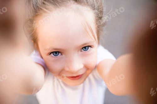 Preview: Child girl making selfie closeup
