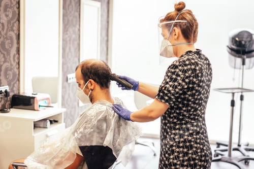 Preview: Hairdresser with security measures for the covid-19, new normality