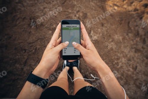 Preview: Woman checking the summary of her run on smartphone