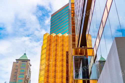 Preview: HONG KONG, CHINA - January, 2021 : Golden tall buildings and glass reflections in Hong Kong Island