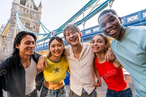 Preview: Multiracial group of happy young friends bonding in London