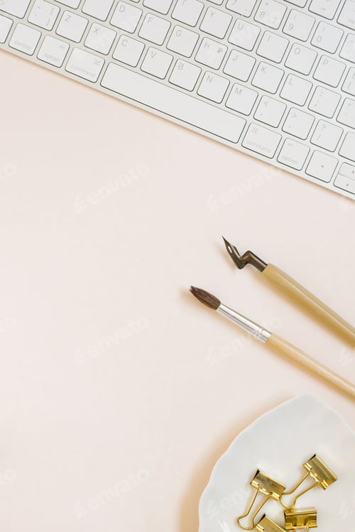 Preview: Calligrapher's Workplace. Keyboard, Caligraphy Pens, Paper Clips are on Beige Background