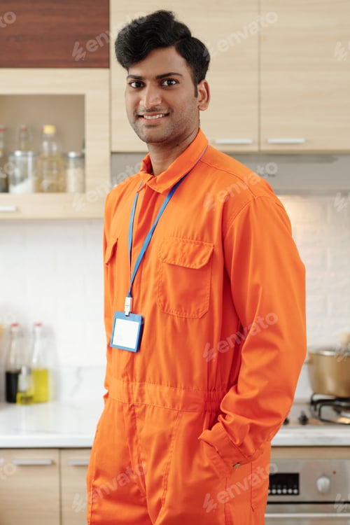 Preview: Smiling plumber with badge
