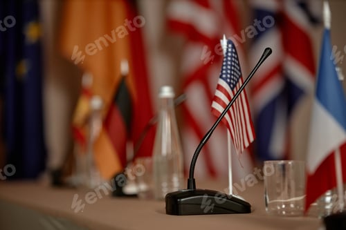 Preview: Conference Table Displaying International Flags and Microphone during Meeting