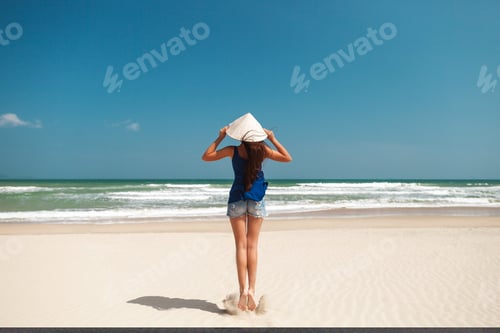 Preview: happy woman jumping on beach. travel to Asia