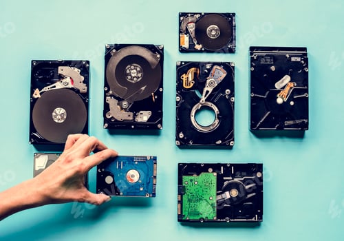 Preview: Hand holding HDD isolated on background