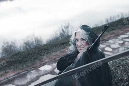 Preview: dark evil character holding euro money outdoors a cloudy sad day - evil concept