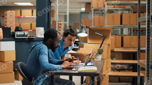 Preview: Business owners doing quality control on products from warehouse
