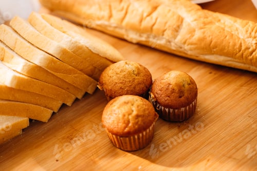 Preview: Fresh homemade baked bread and sliced bread on wooden table