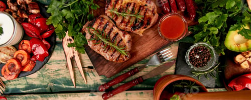 Preview: Banner with Steak pork grill on wooden cutting board with a variety of grilled vegetables