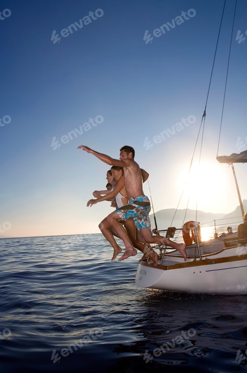 Preview: Young people jumping from sail boat