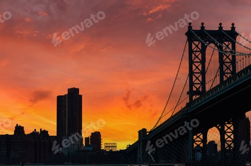 Preview: Manhattan Bridge and skyline silhouette view from Brooklyn at sunset