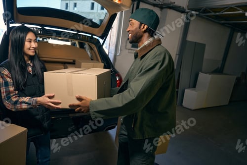Preview: Couple takes things out of a car in a storage service