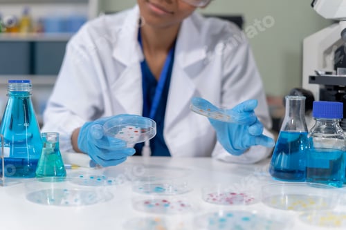 Preview: Scientist mixing chemical liquids in the chemistry lab.