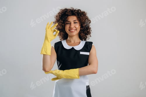 Preview: Okay, fine, hand gesture from cleaning service woman that is in the studio