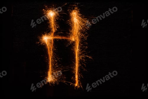 Preview: The English Letter H Made Of Sparklers On Black Background