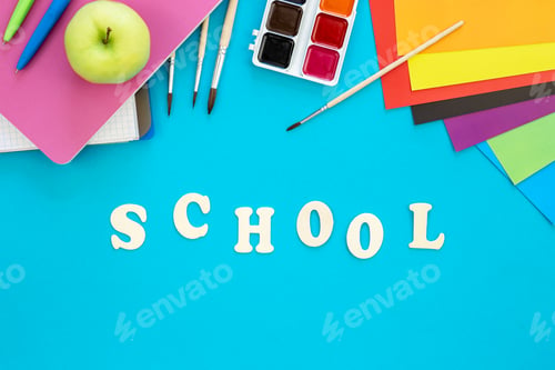 Preview: Colourful school supplies on a blue background, back to school concept.