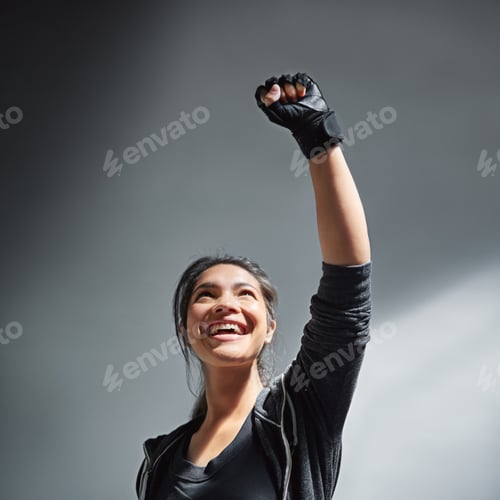 Preview: Pumped up for fitness. Shot of an excited young woman in sports clothing punching the air.