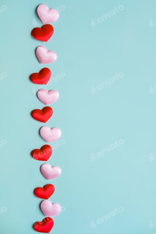 Preview: Valentine's Day vertical banner. White and red hearts on pastel blue background