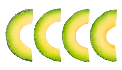 Preview: Falling avocado slices isolated on white background