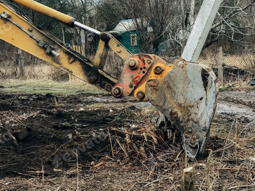 Vista previa: Excavator uprooting trees on land in countryside
