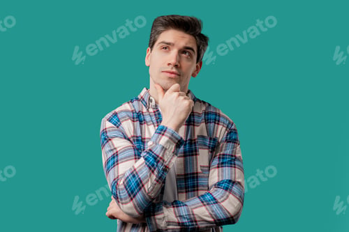 Preview: Thinking around man on blue background. Smart student 30s guy searching answer