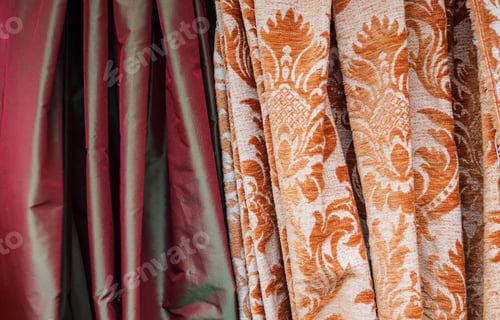 Preview: Closeup shot of surfaces and textures of folded fabrics cloth found at a fabrics market