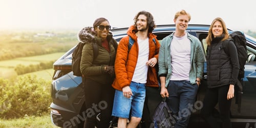 Preview: Group of diverse friends on road trip, standing by car.