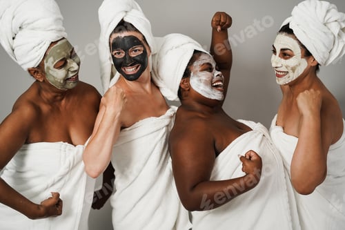 Preview: Multigenerational women having fun wearing face beauty mask