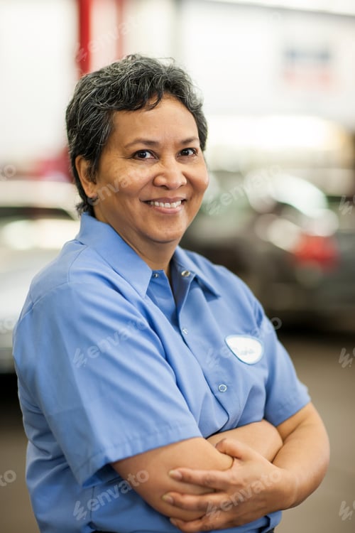 Preview: Portrait of female hispanic mechanic in auto repair shop
