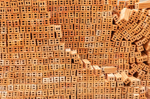 Preview: Pattern of stacked brown brick from abstract background. Building and construction backdrop.
