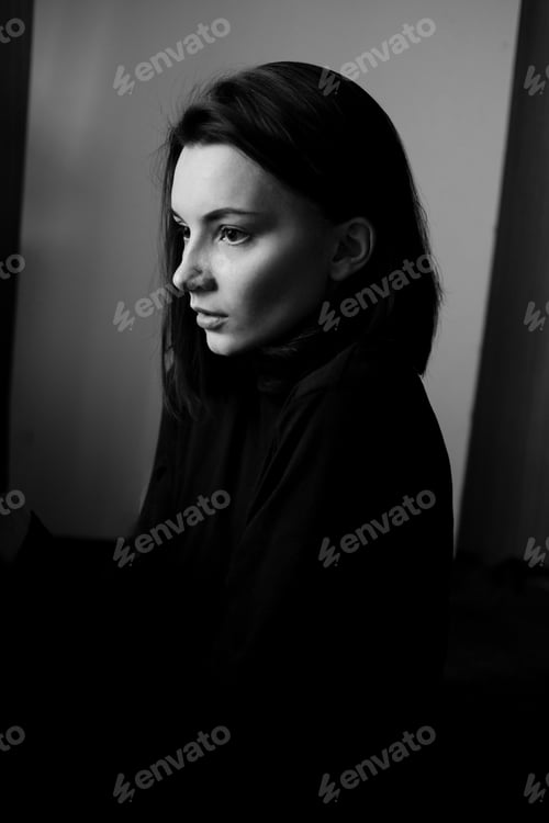 Preview: Black and white portrait of young beautiful woman in profile