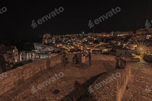 Preview: Stunning aerial view of the historic Matera skyline illuminated by lights