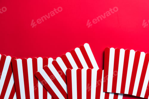 Preview: Cinema and Watching Movies Conccept Border Backgground. Red Strtiped Popcorn Buckets