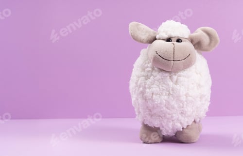 Preview: Soft toy sheep on a purple background with space for your text.