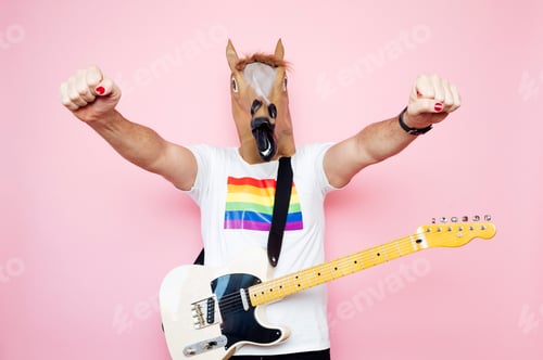 Preview: Man with horse mask demonstrates the strength of his arms and with hanging electric guitar