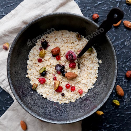 Preview: Oatmeal with Berries and Nuts in a Bowl