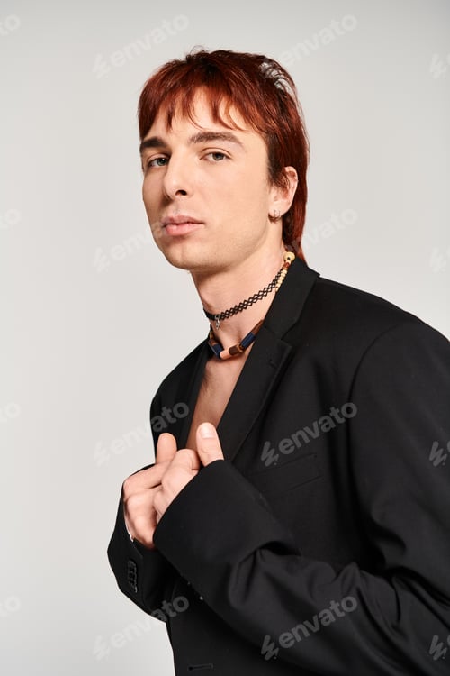 Preview: Crimson-haired rebel in ebony garb
